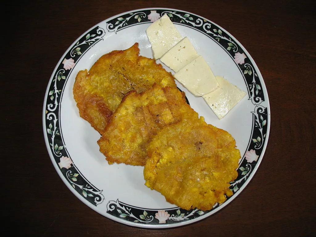 Patacones Patacones with cheese, a common breakfast in Colombia.