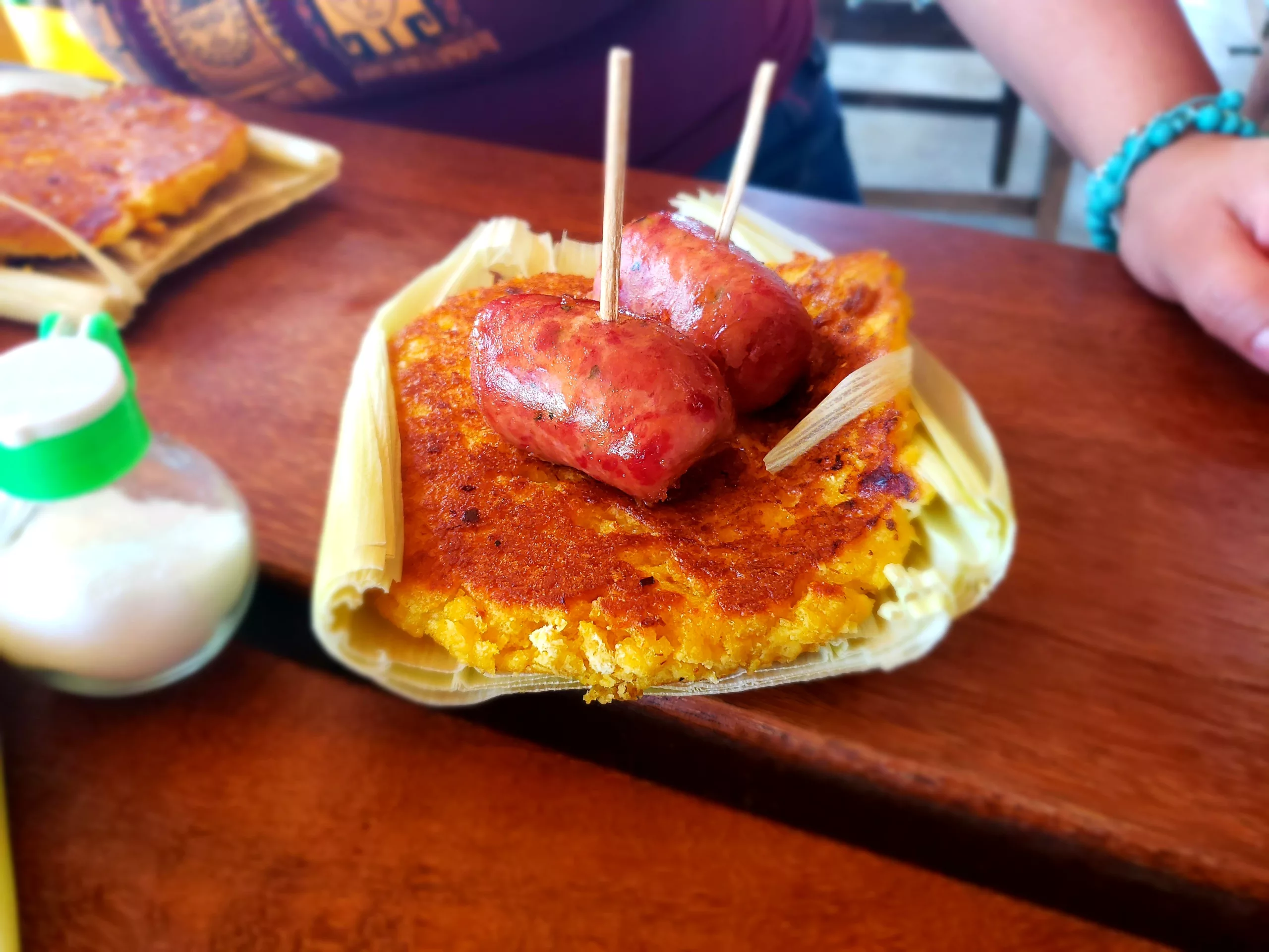 Chorizo antioqueno Chorizo antioqueno on top of a choclo arepa in Mesa de Los Santos, Colombia.